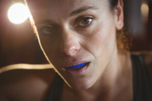 woman wearing a blue mouth guard